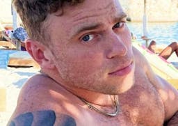 Gus Kenworthy makes a splash on Greek vacation … and is that a new boyfriend?